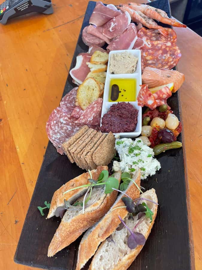 Waiheke: Scenic Taste and Graze Tour with Wine, Whisky, Beer - Mudbrick Vineyard and views toward Auckland